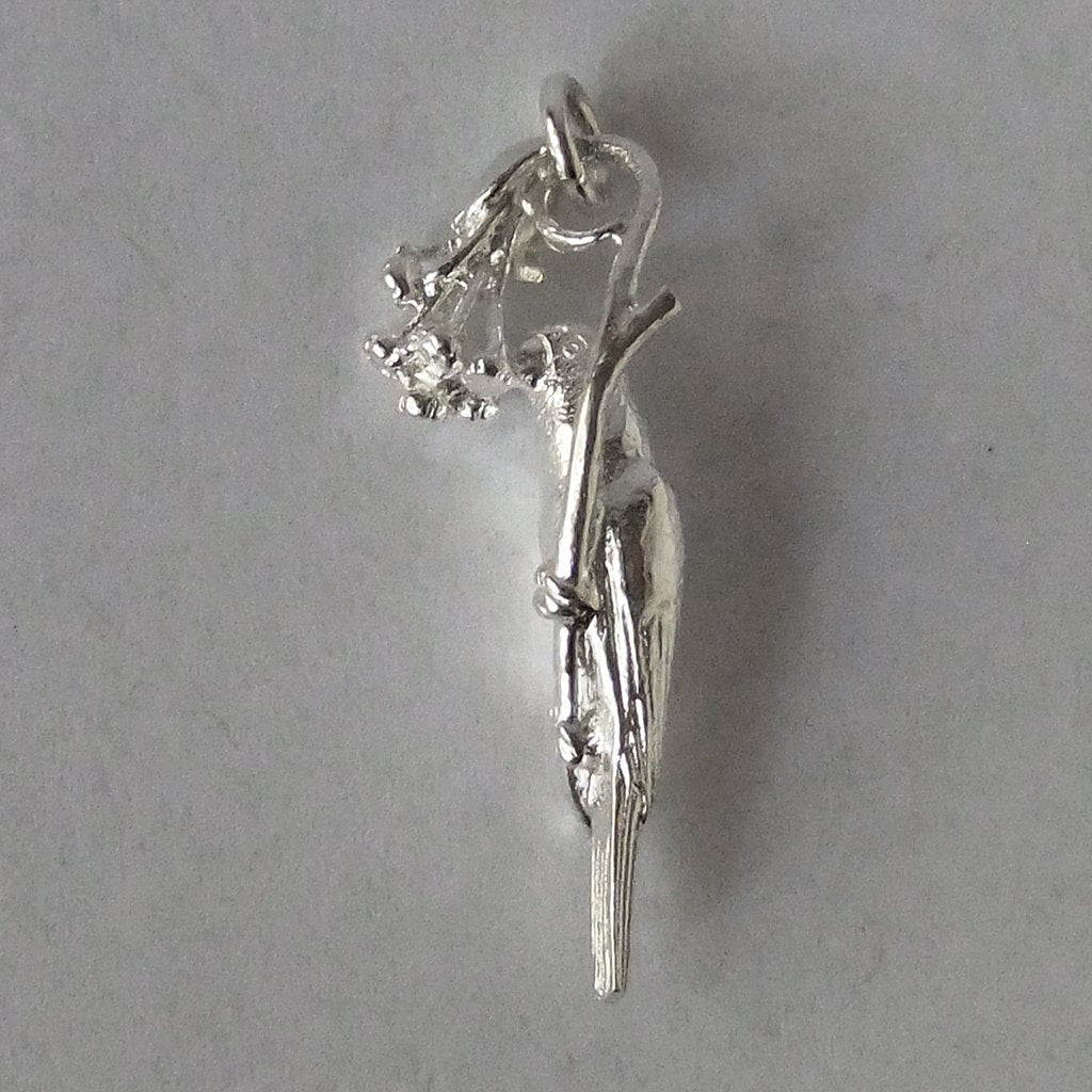 silver lorikeet bird charm on grey background