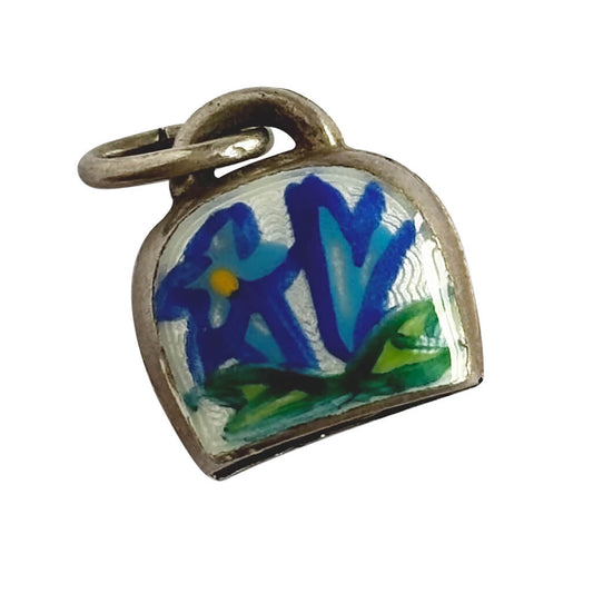 Vintage Silver Swiss Bell Charm with blue gentian flower on a white background