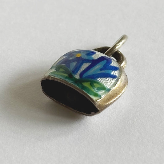 Vintage Silver Swiss Bell Charm with blue gentian flower on a white background