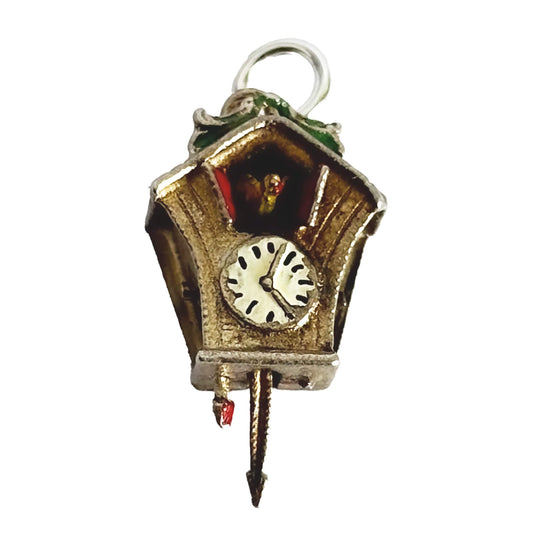 Cuckoo clock charm on a white background