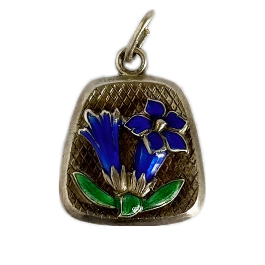 Silver pendant with blue floral design on a white background