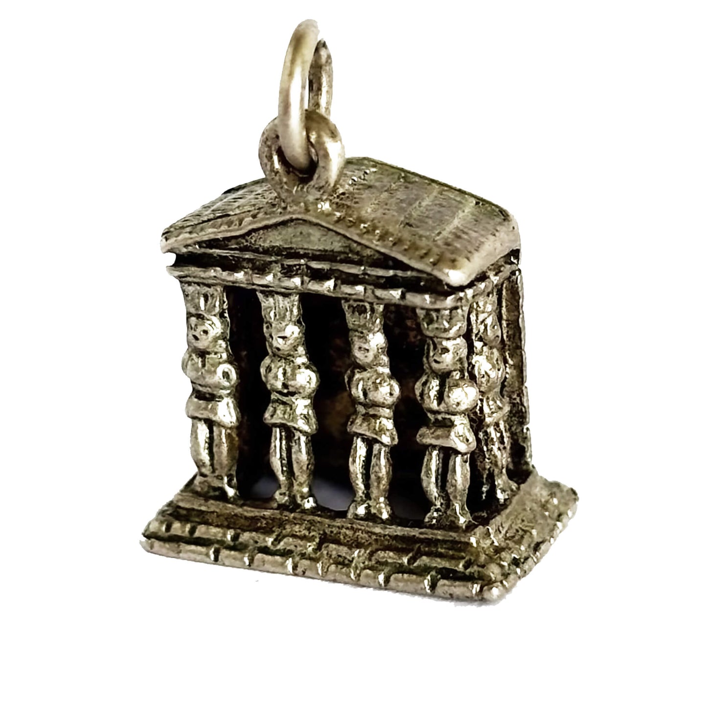Silver temple charm with figures on a white background