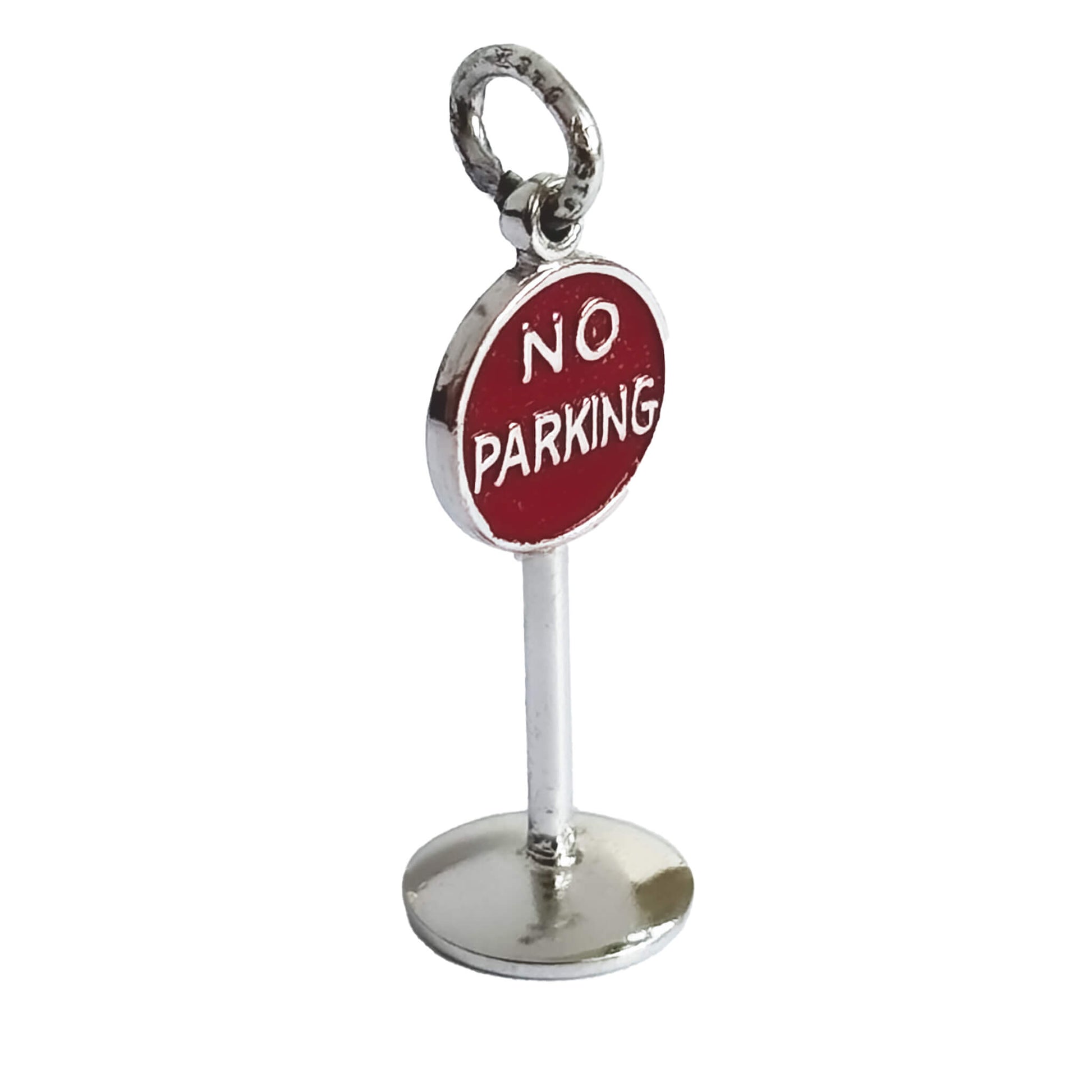 A vintage sterling silver no parking sign charm on a white background.