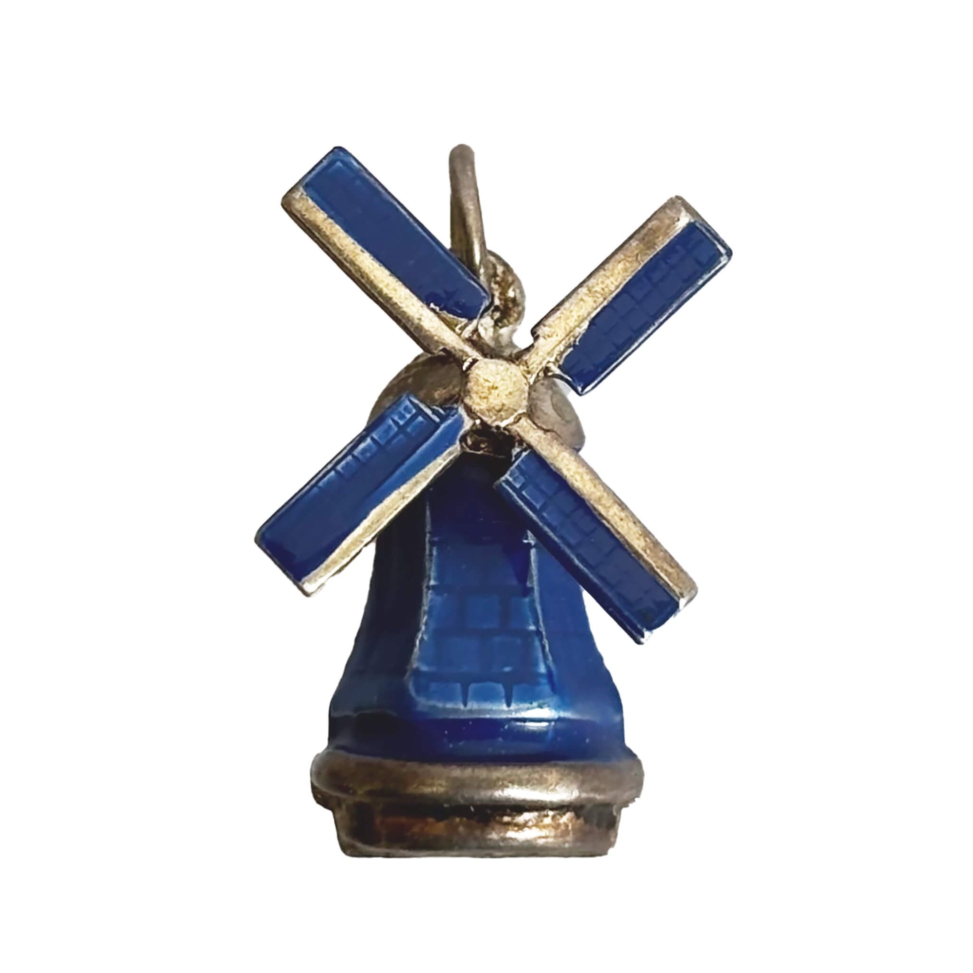 Vintage silver and enamel windmill charm on a white background