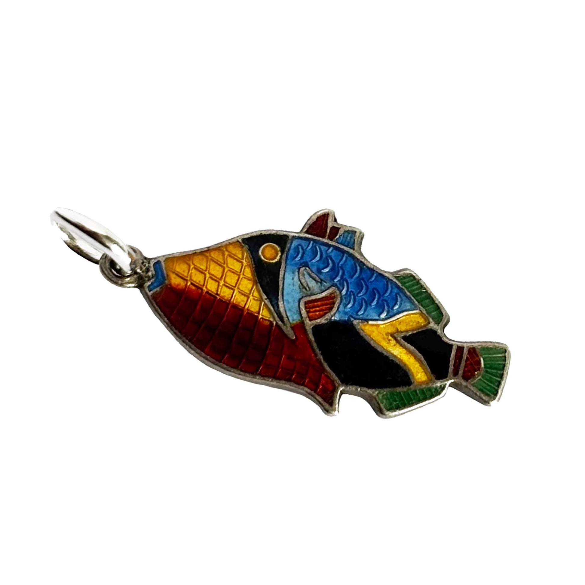 A vintage silver and colourful enamel tropical fish charm on a white background