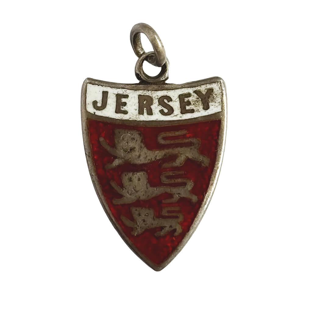 Silver and enamel shield charm for Jersey Channel Islands on a white background.