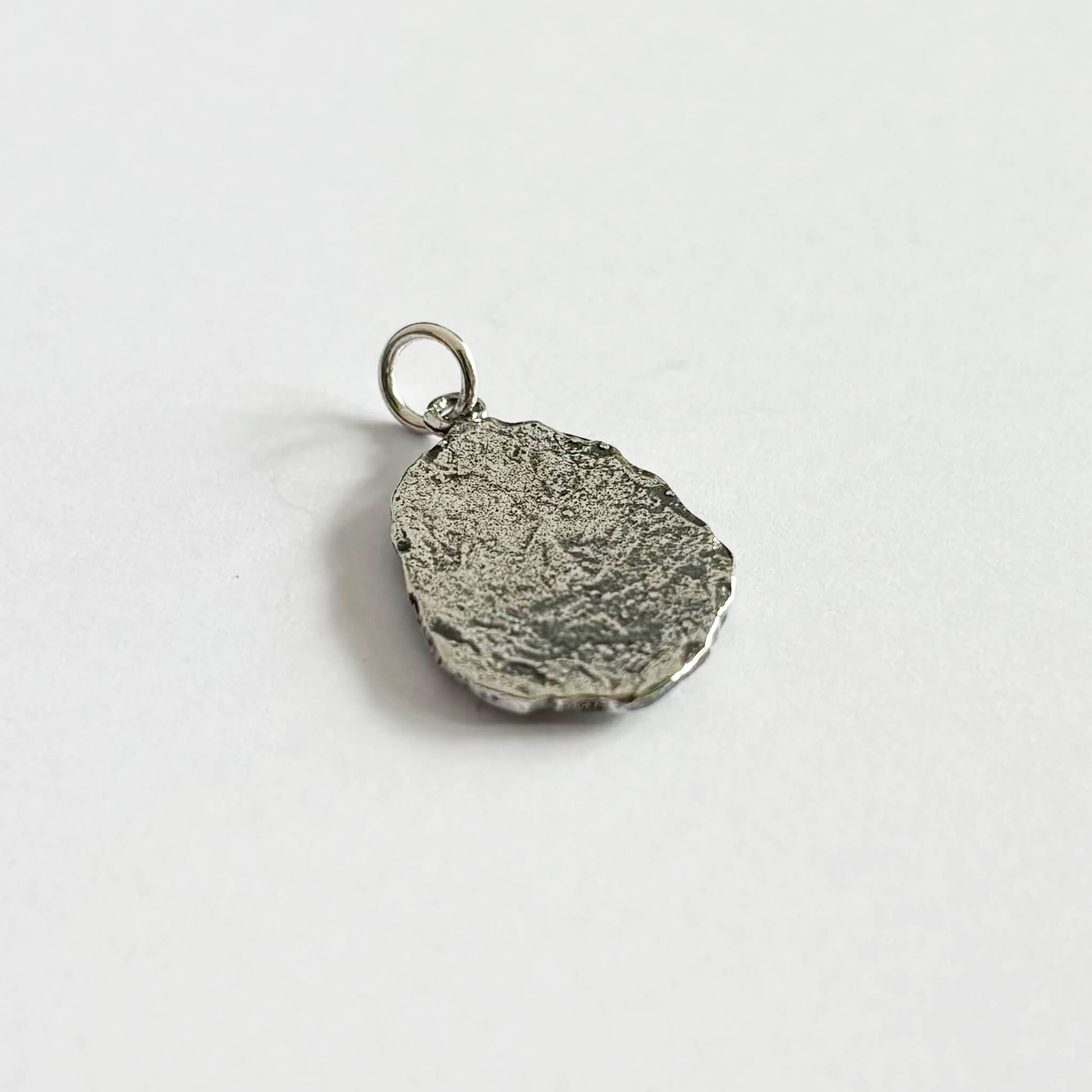 Back of sterling silver trilobite fossil charm