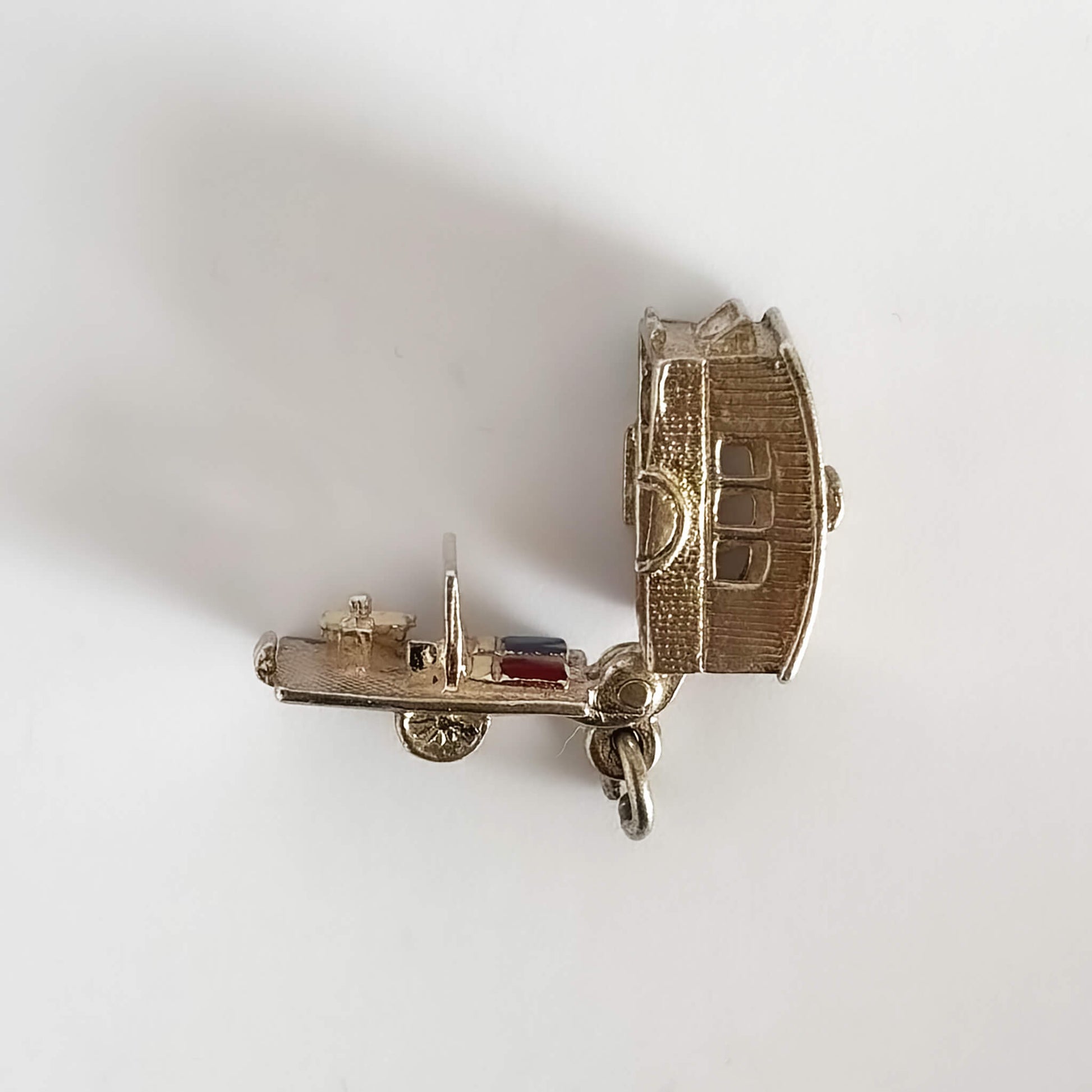 Vintage silver caravan charm opens to enamelled furniture