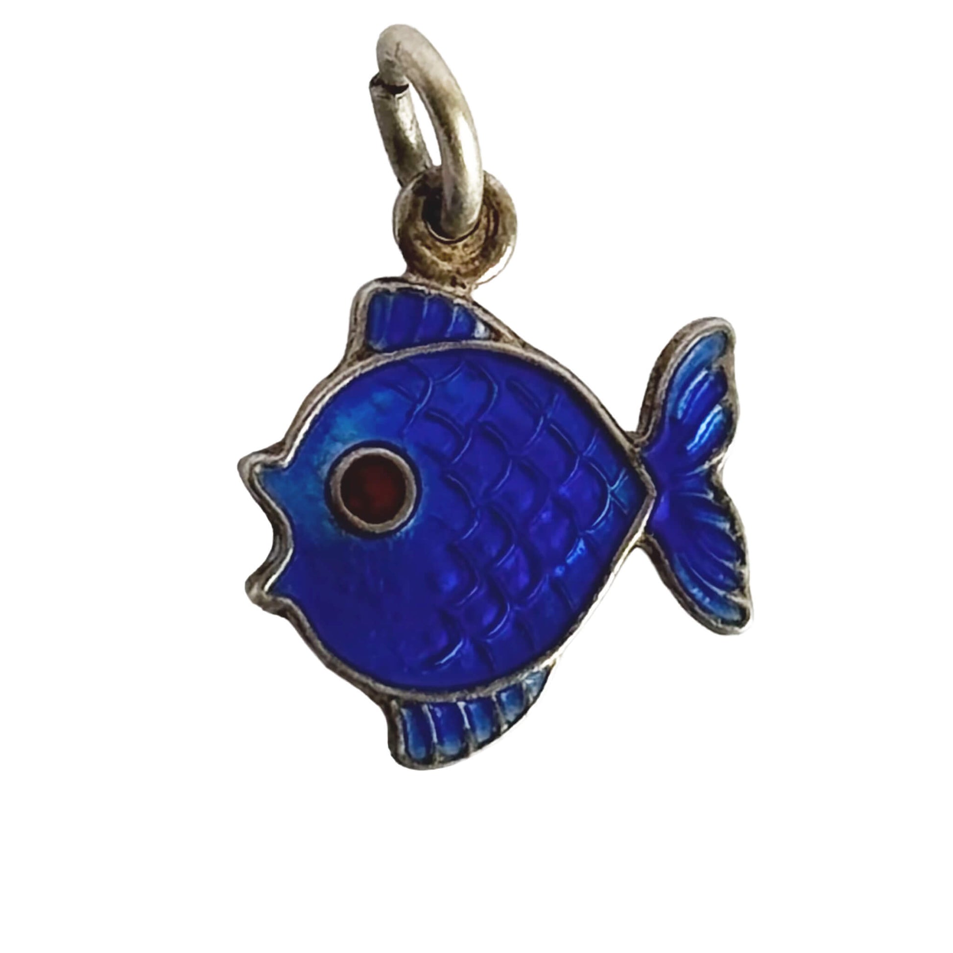 Blue fish pendant with a red eye on a white background