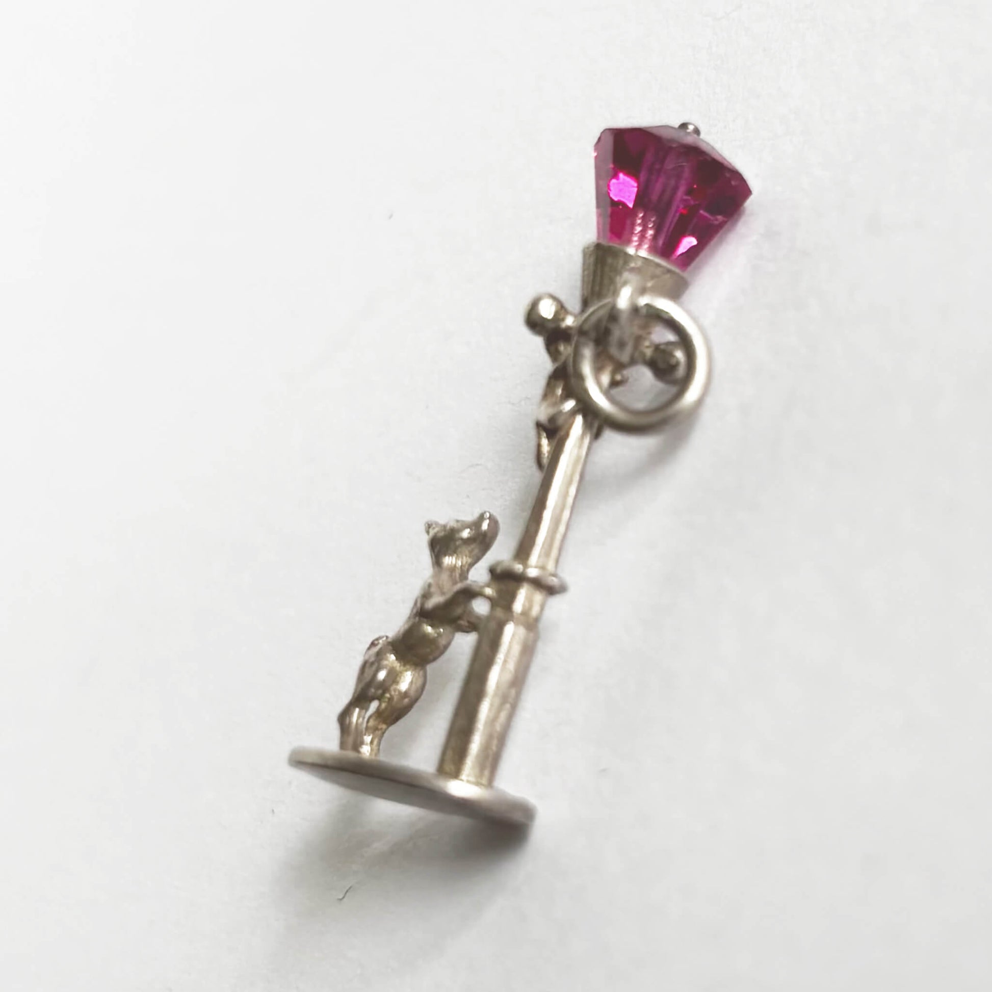 Dog and lamppost charm with pink crystal