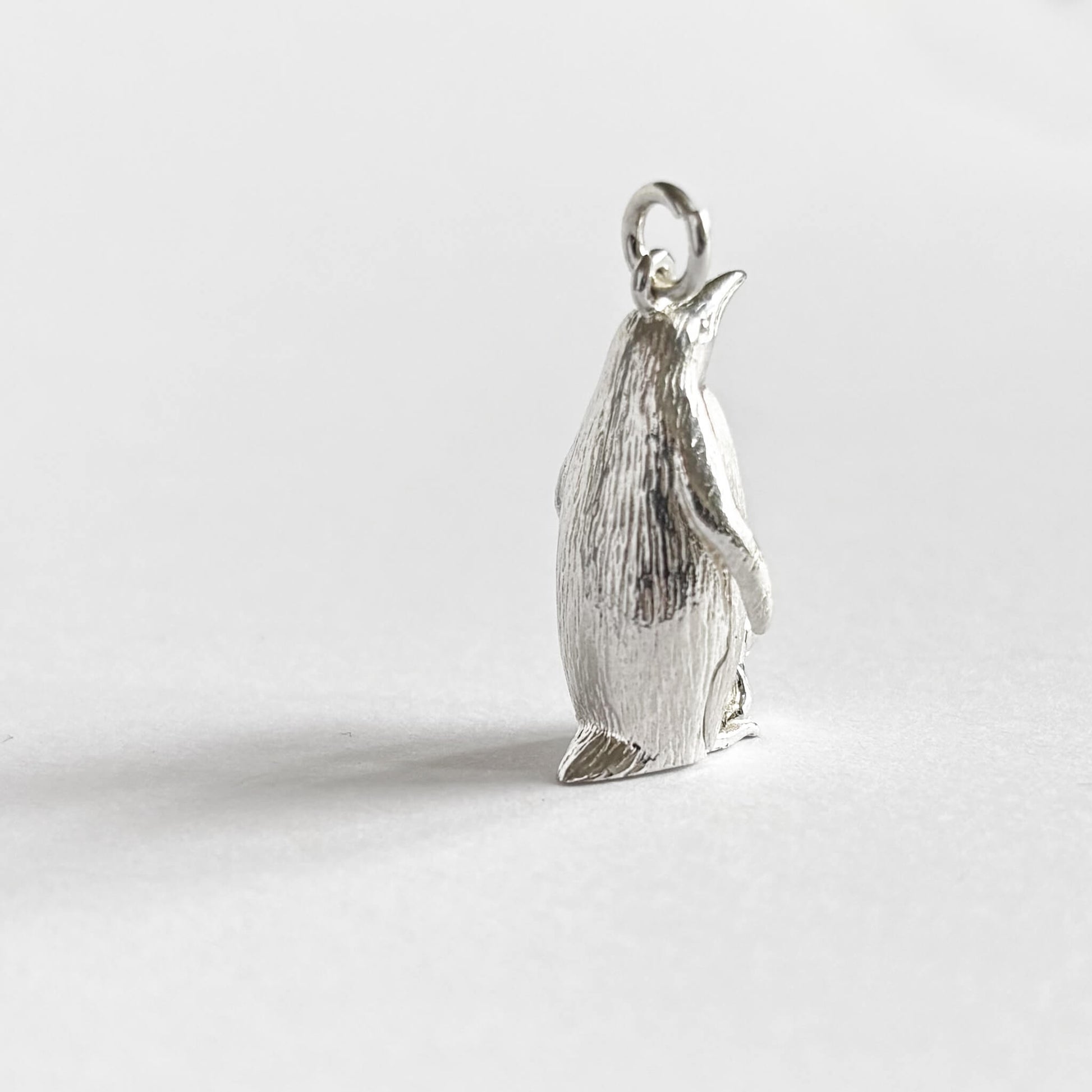 Emperor penguin with chick pendant in sterling silver