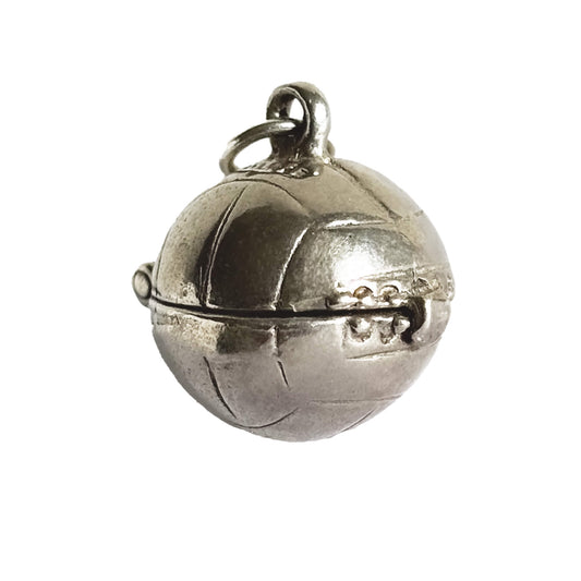 Vintage silver Nuvo football charm on a white background