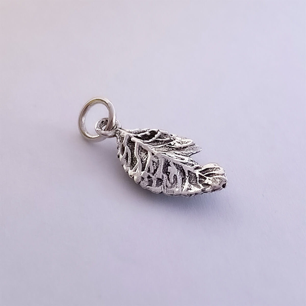 Leaf and caterpillar charm or pendant