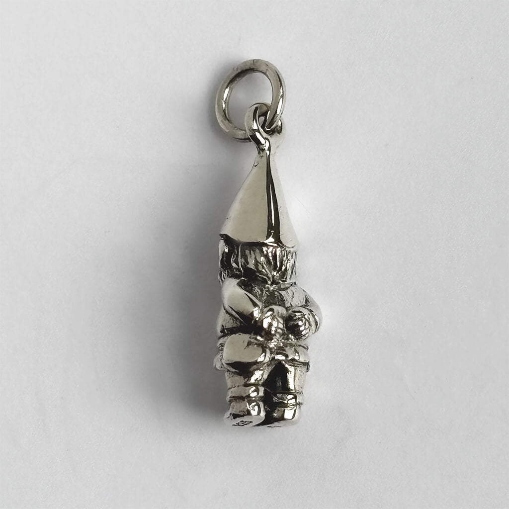 Silver gnome pendant on a white background