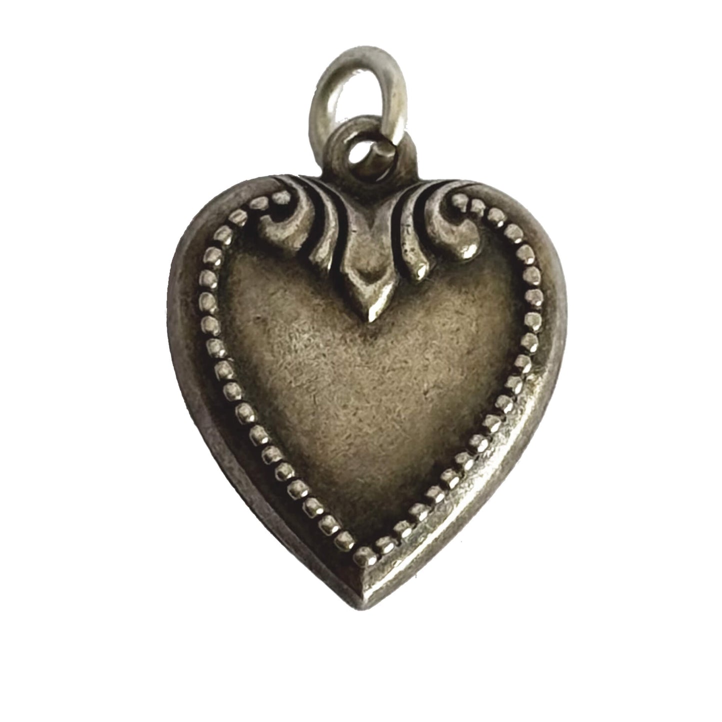 Sterling silver antique heart charm on a white background