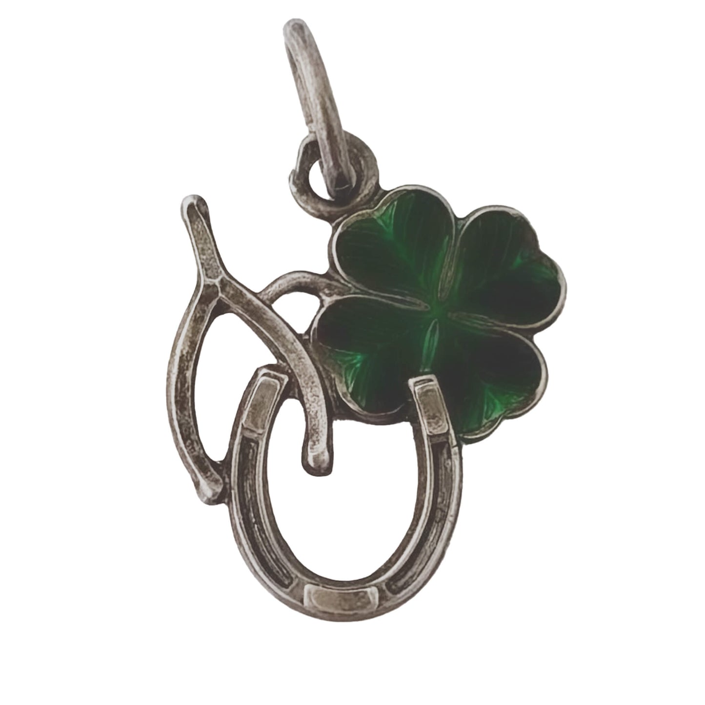 Silver pendant with green four-leaf clover and horseshoe on a white background
