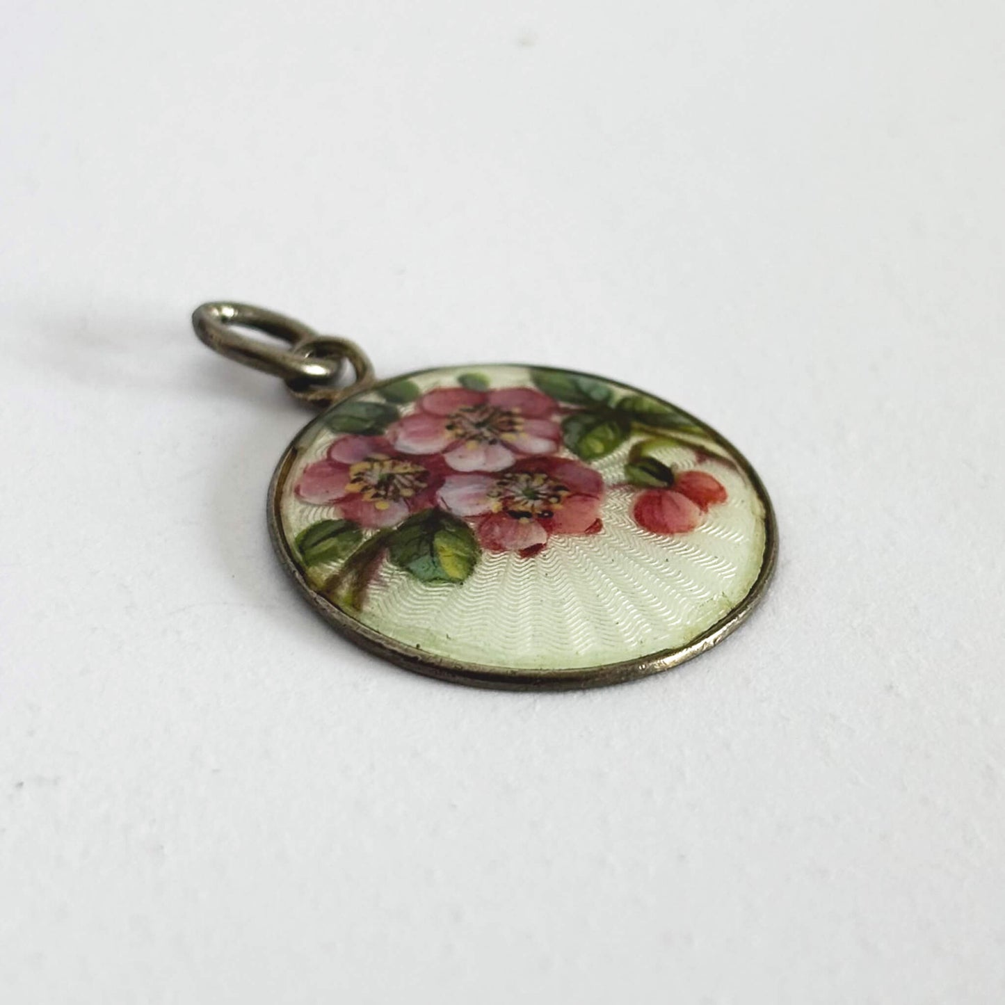 Round floral pendant on a white background
