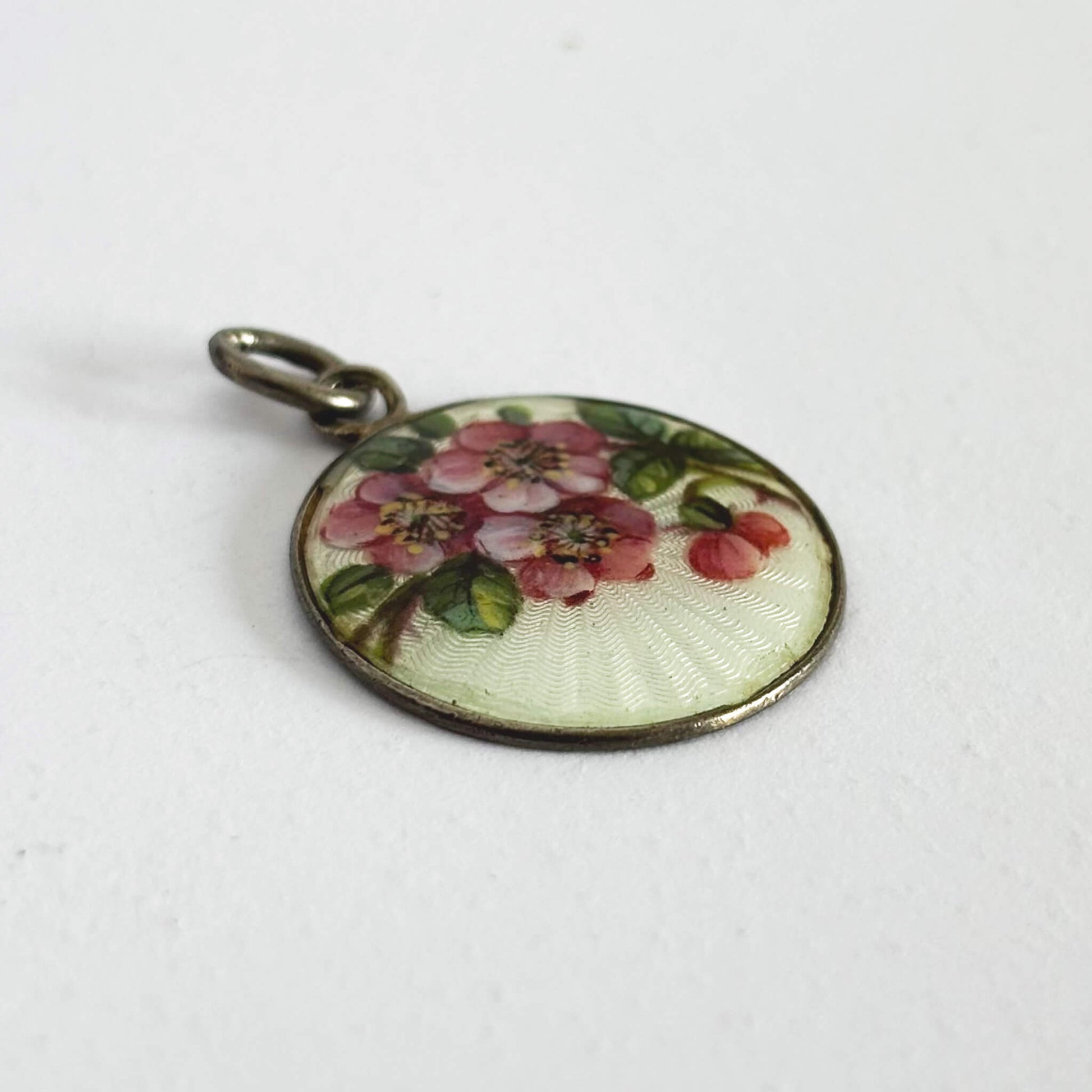 Round floral pendant on a white background