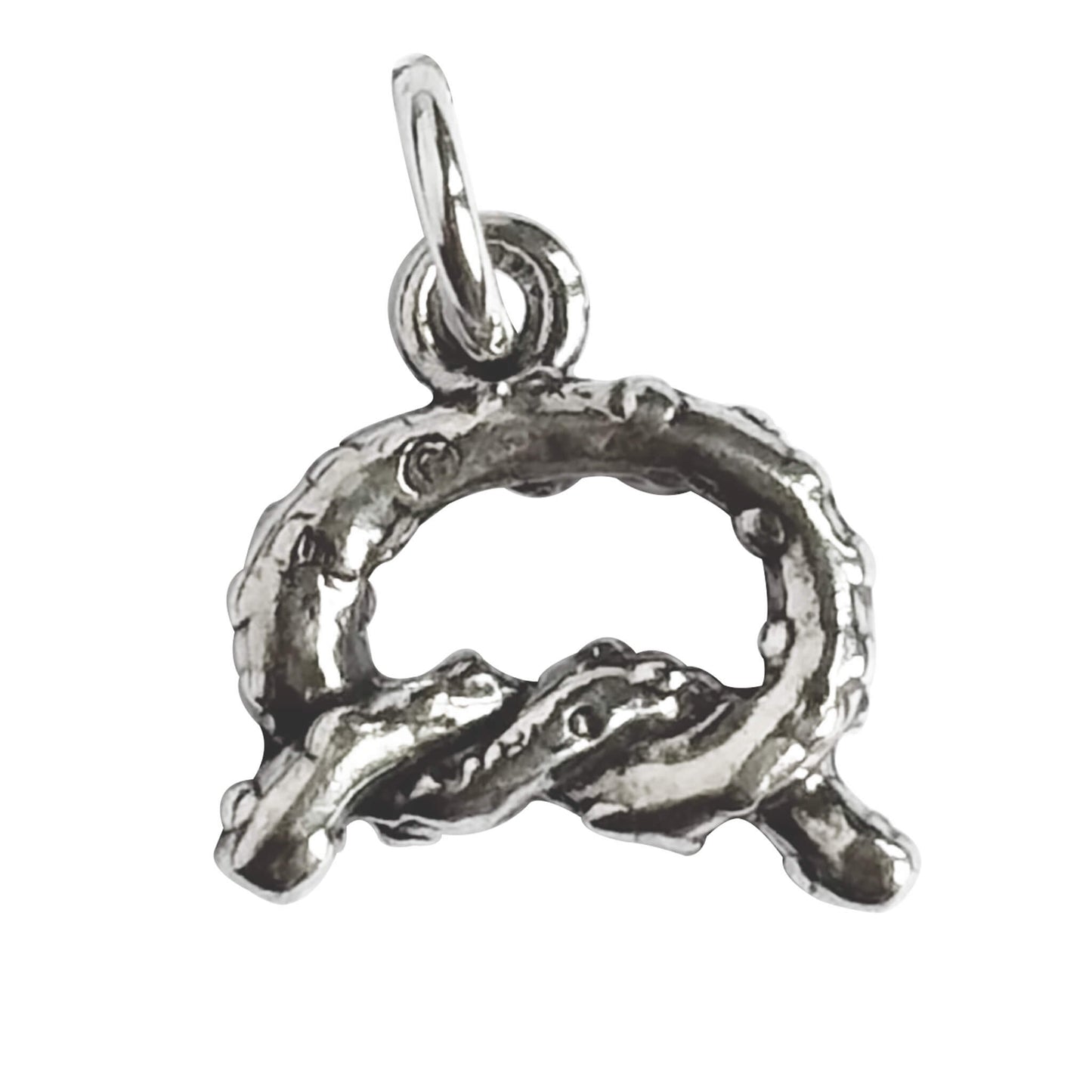 Sterling silver pretzel charm on a white background