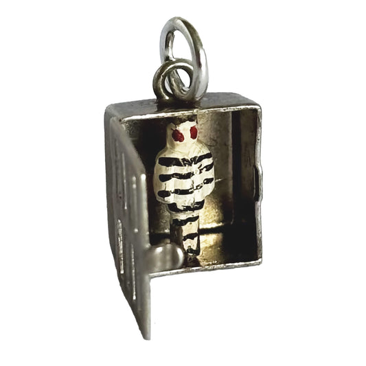 Sterling silver prisoner in prison cell charm on a white background