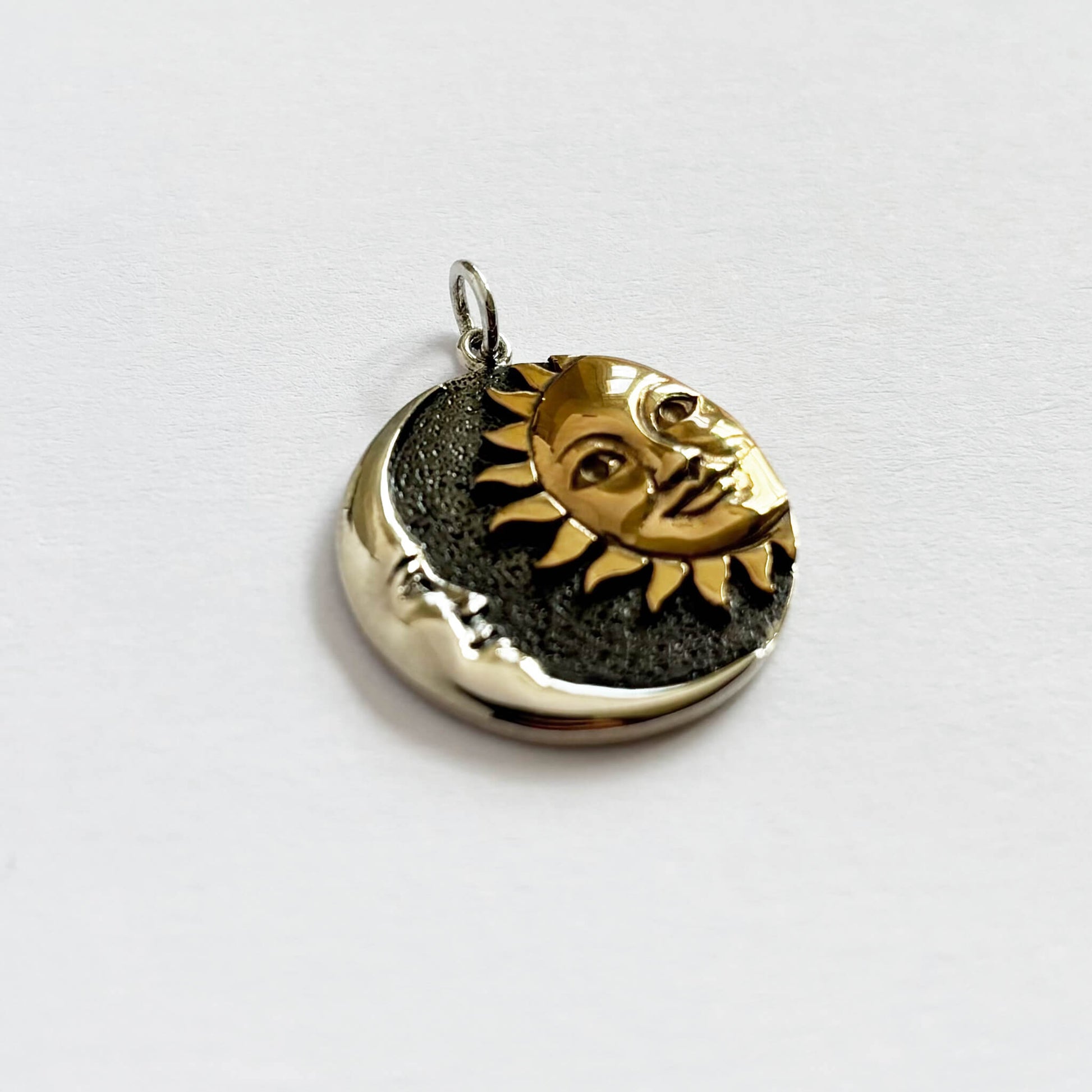 Sterling silver and bronze sun and moon charm