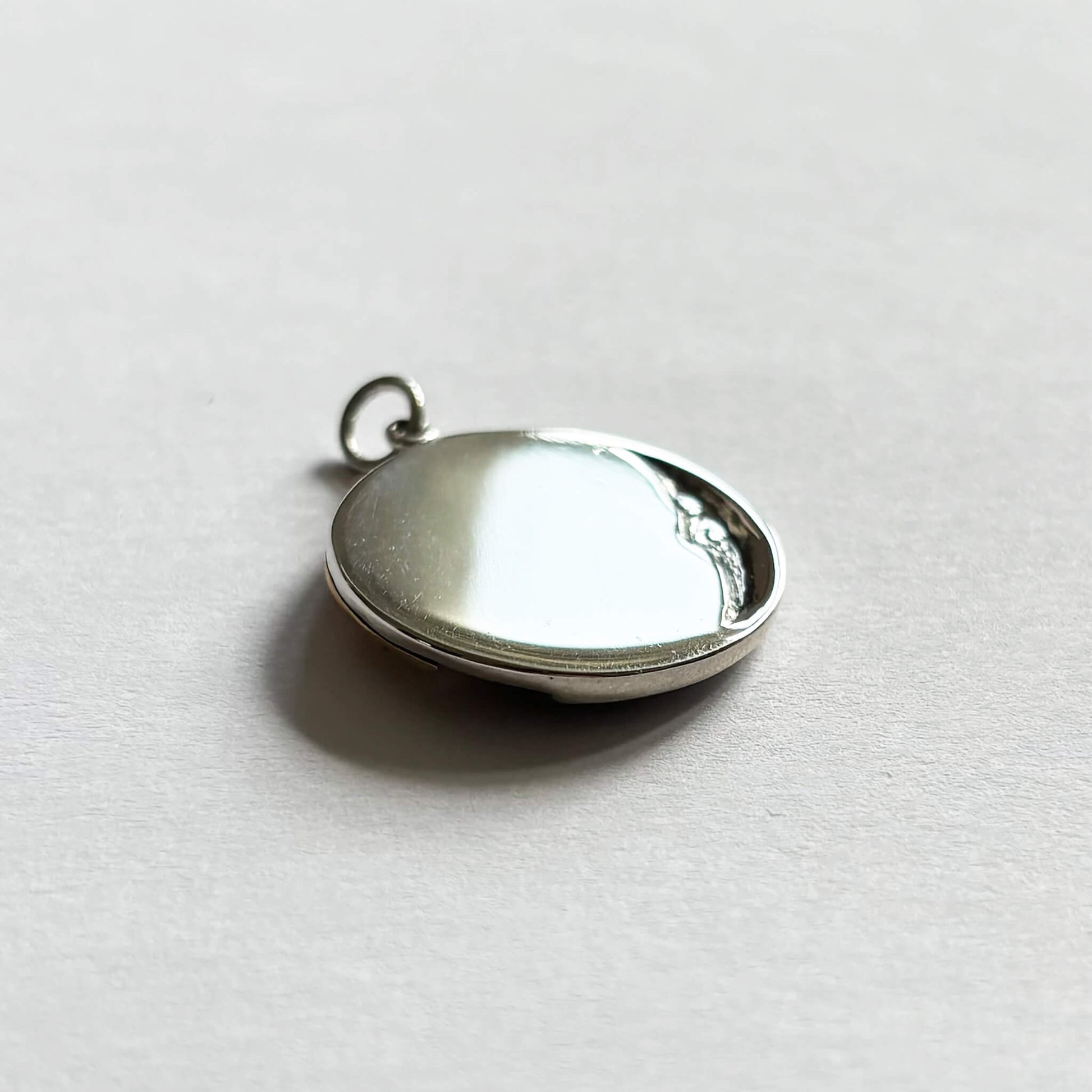 Sterling silver and bronze sun and moon charm back