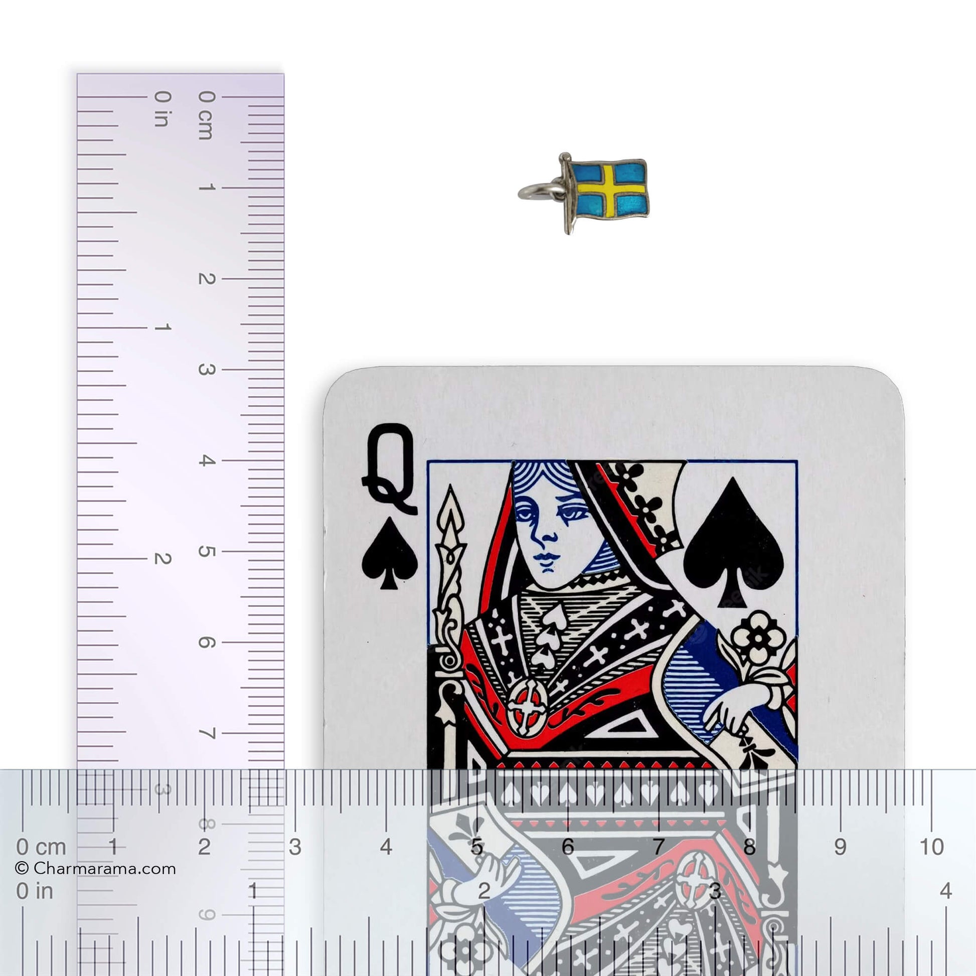 Small flag of Sweden charm with playing card and ruler for scale