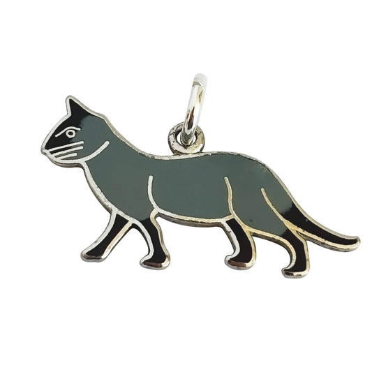 Vintage grey and black enamelled silver cat charm on white background