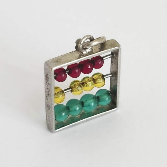 Abacus pendant with colourful counters on a white background