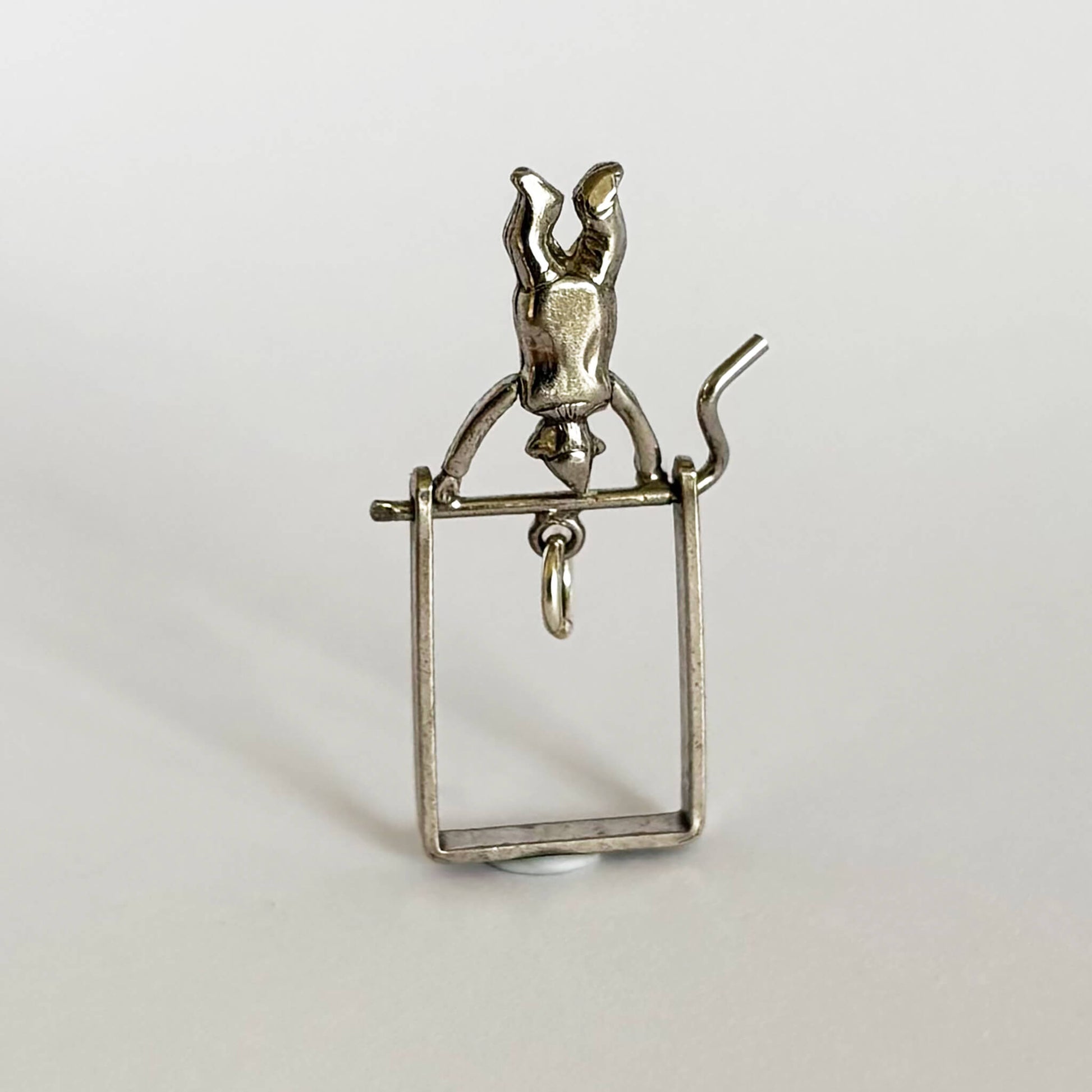 Vintage acrobat charm in sterling silver and white enamel