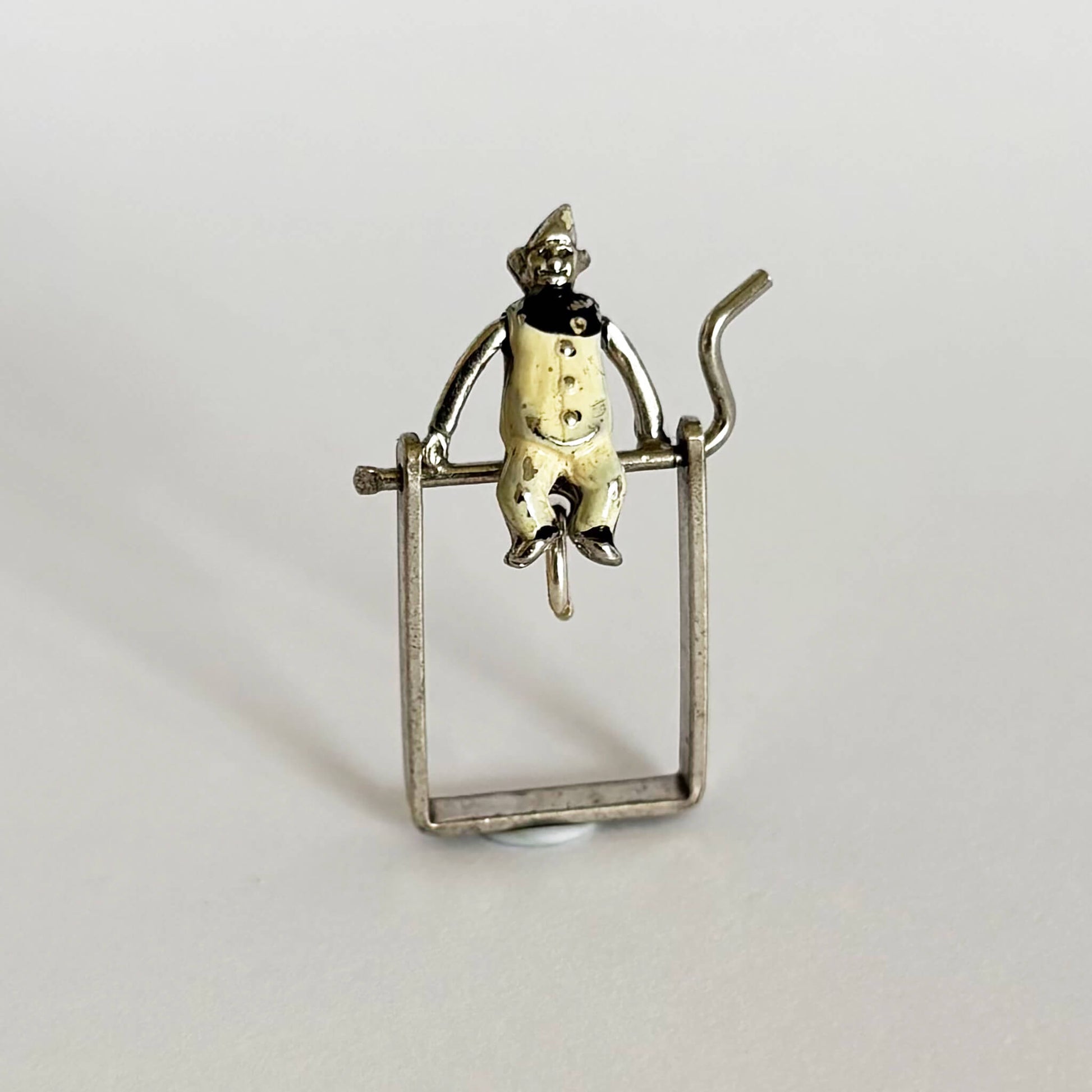 Vintage silver acrobat clown charm