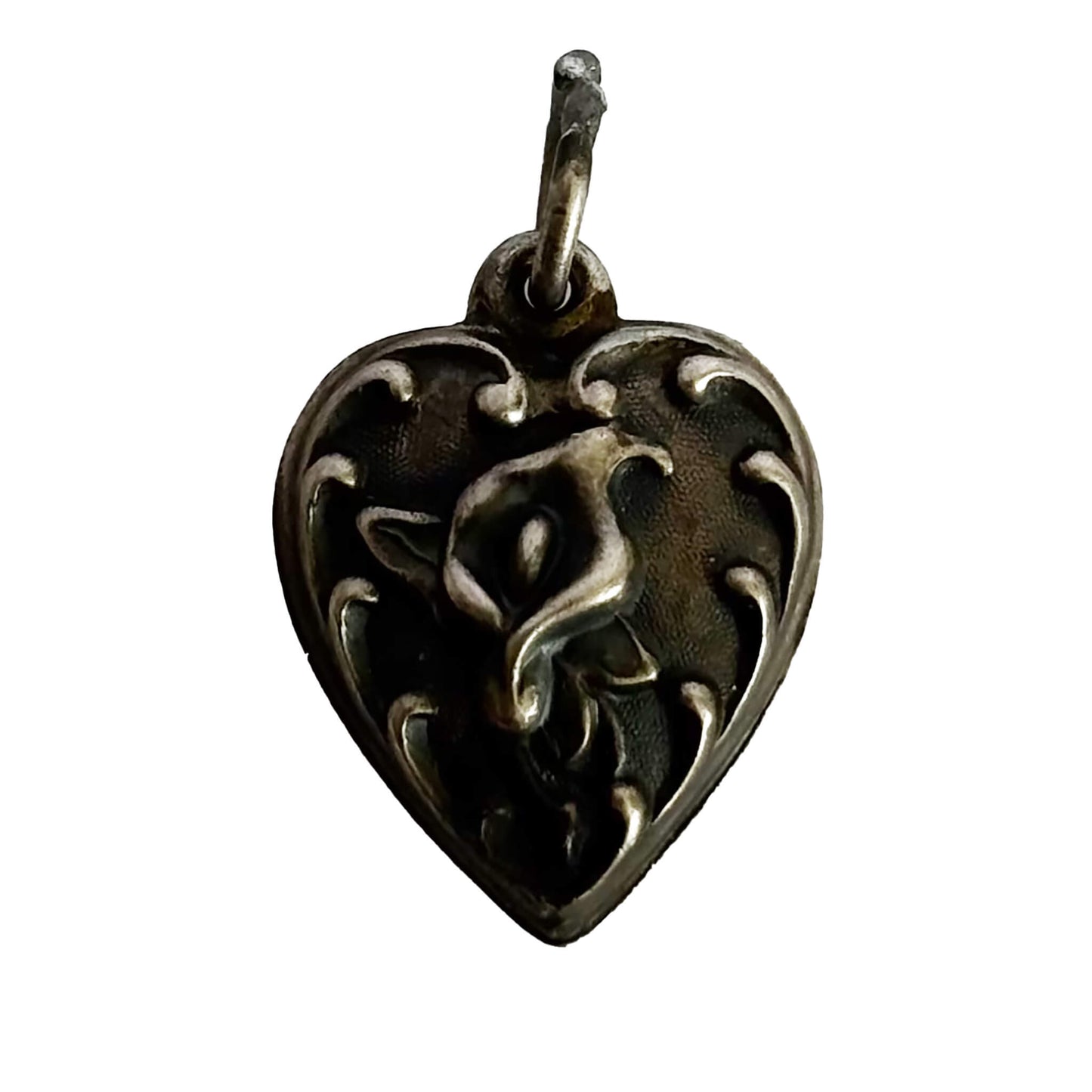 Heart-shaped pendant with intricate calla lily flower design on a white background