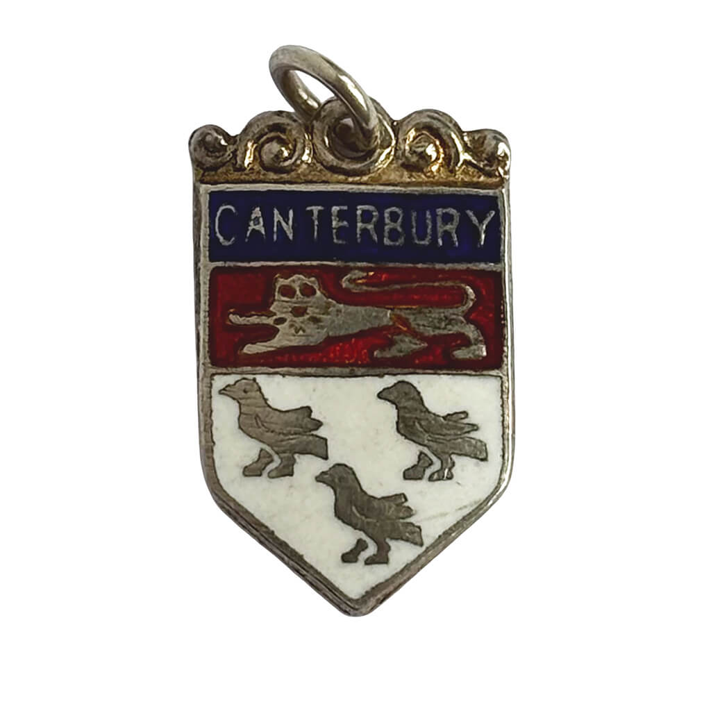 Silver and enamel pendant with 'Canterbury' text and crest on a white background