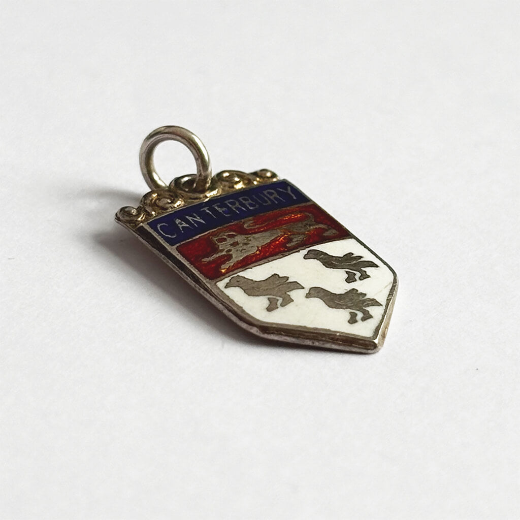 Coat of arms pendant with 'Canterbury' text on a white background