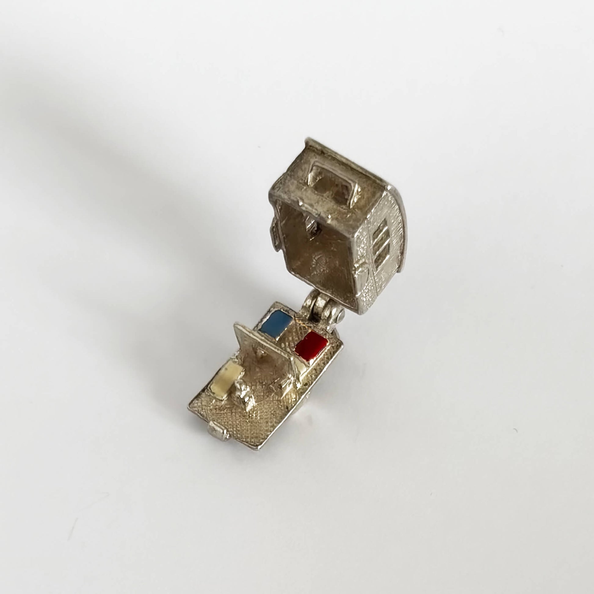 Vintage silver caravan charm opens to enamel furniture