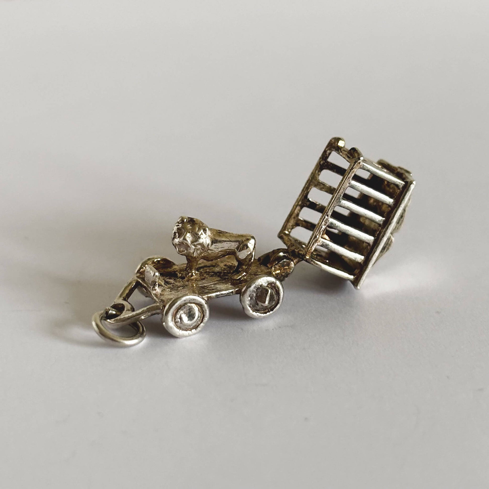 silver circus wagon charm open revealing lion on a white background