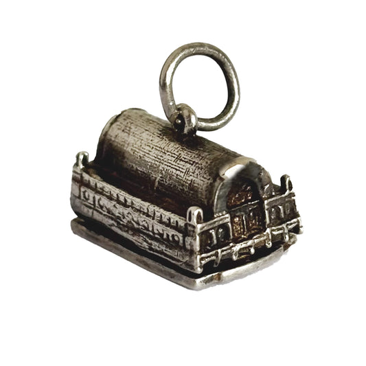 A silver 3 dimensional Covent Garden charm on a white background