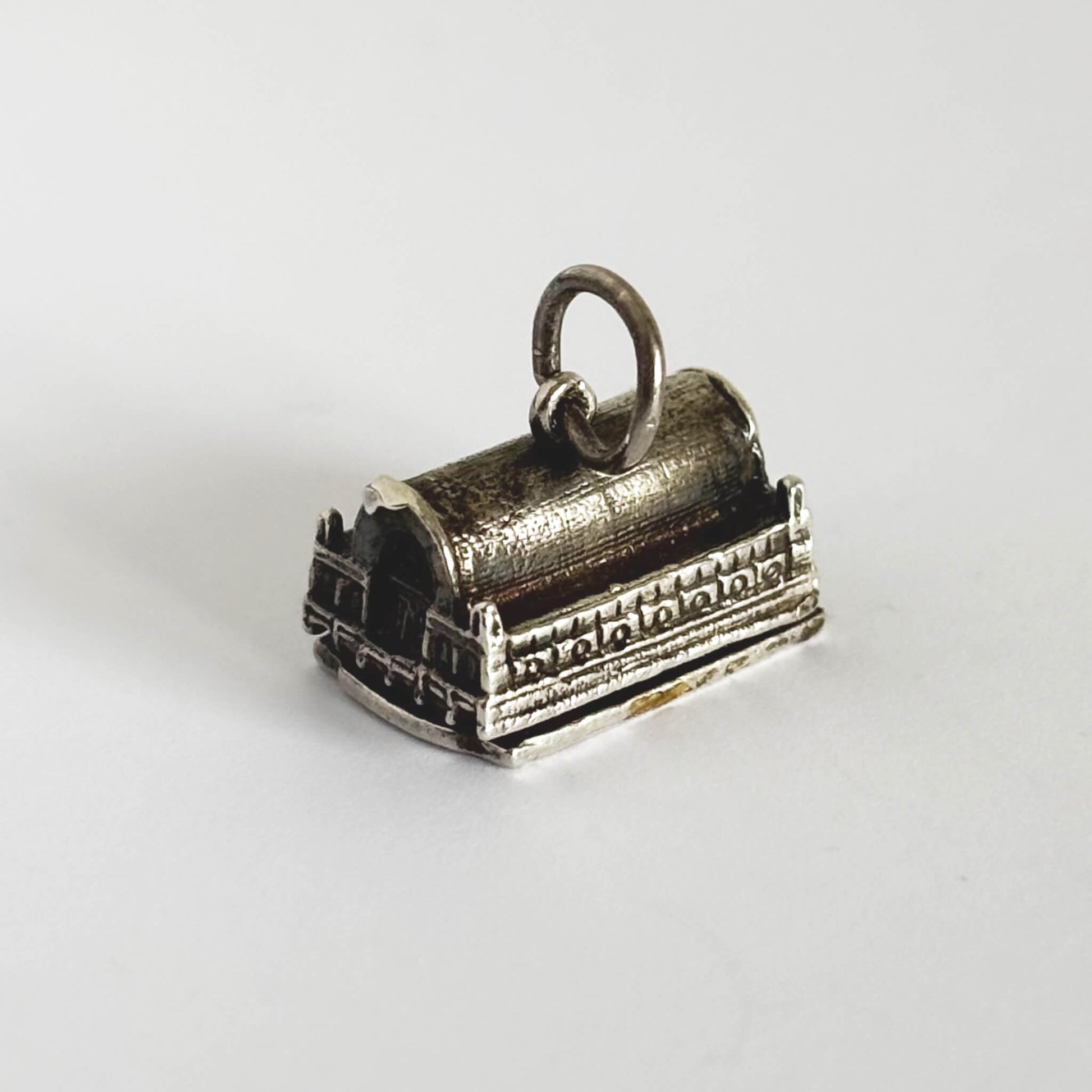 A silver Covent Garden pendant on a white background