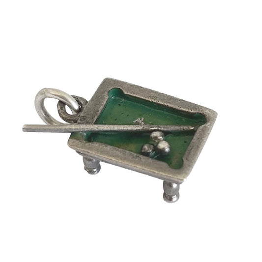 Silver and green enamel pool table charm with cue and three balls on a white background.