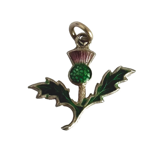 Silver and enamel thistle charm on a white background