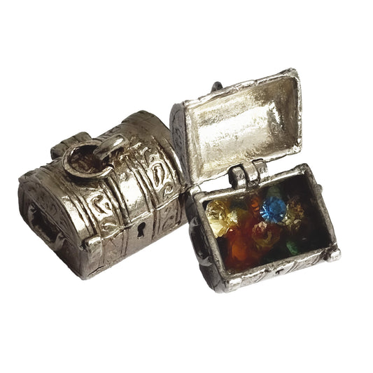 Vintage silver treasure chest charm shown in closed position and open to show crystals inside on a white background.