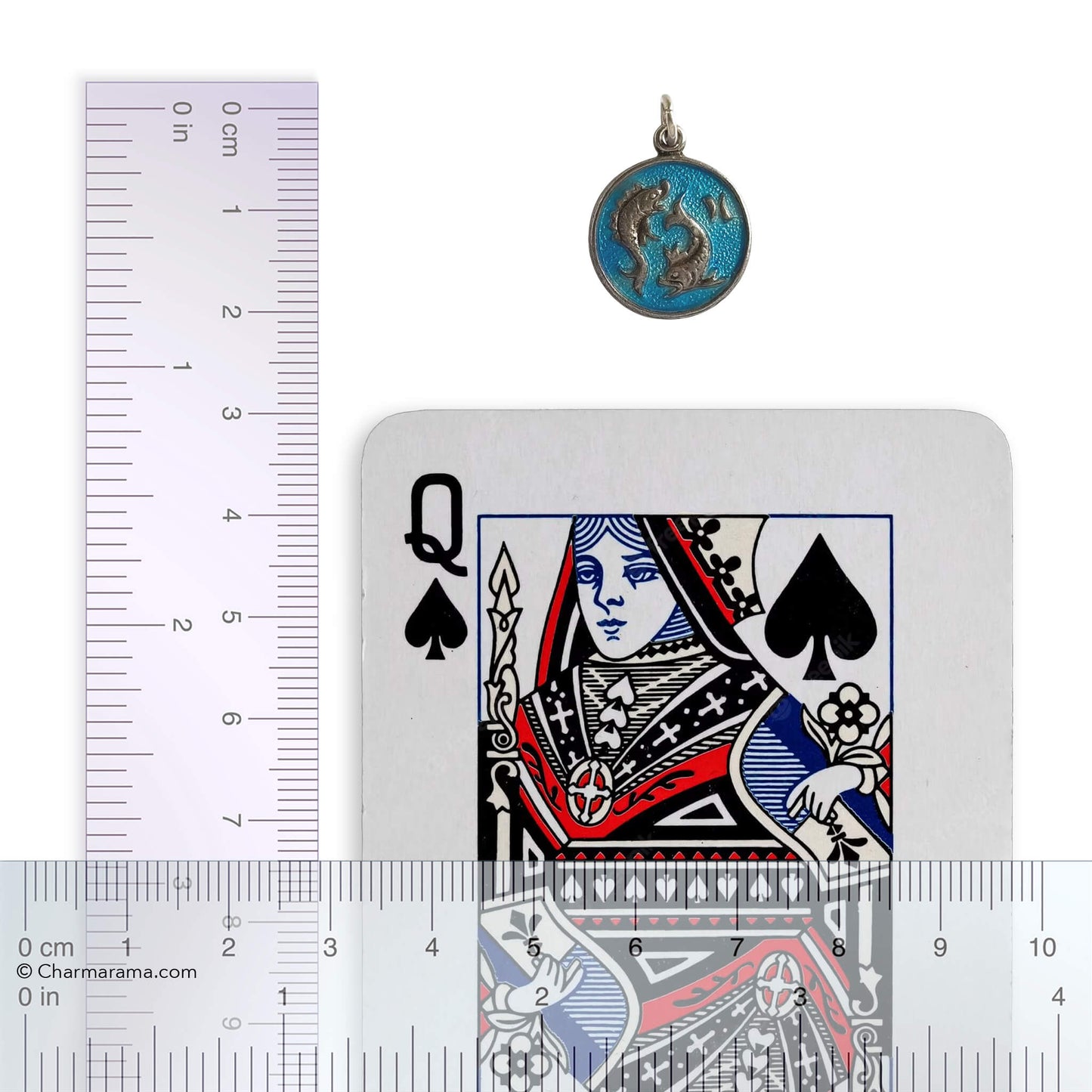 Pisces pendant with a playing card with a ruler for scale