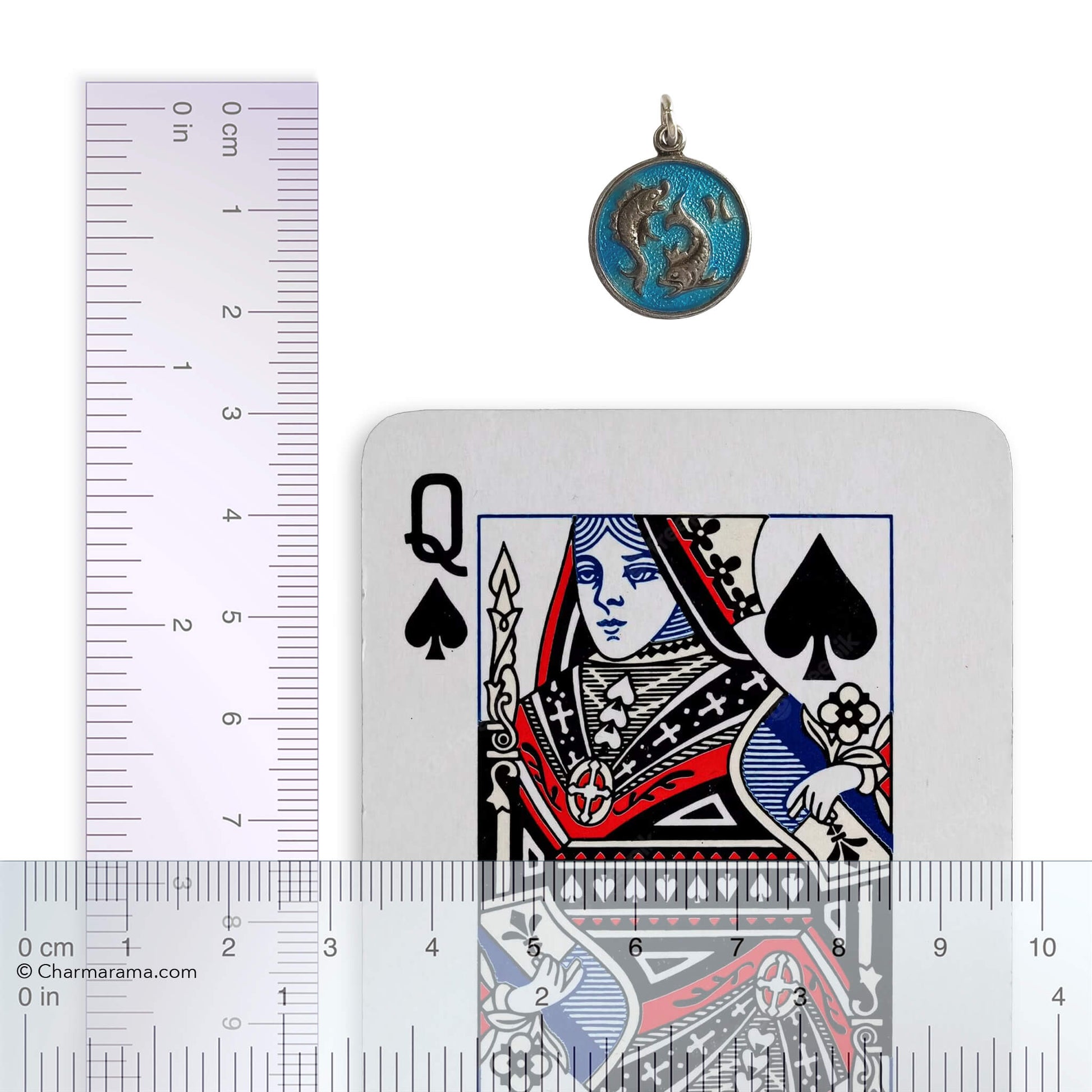 Pisces pendant with a playing card with a ruler for scale