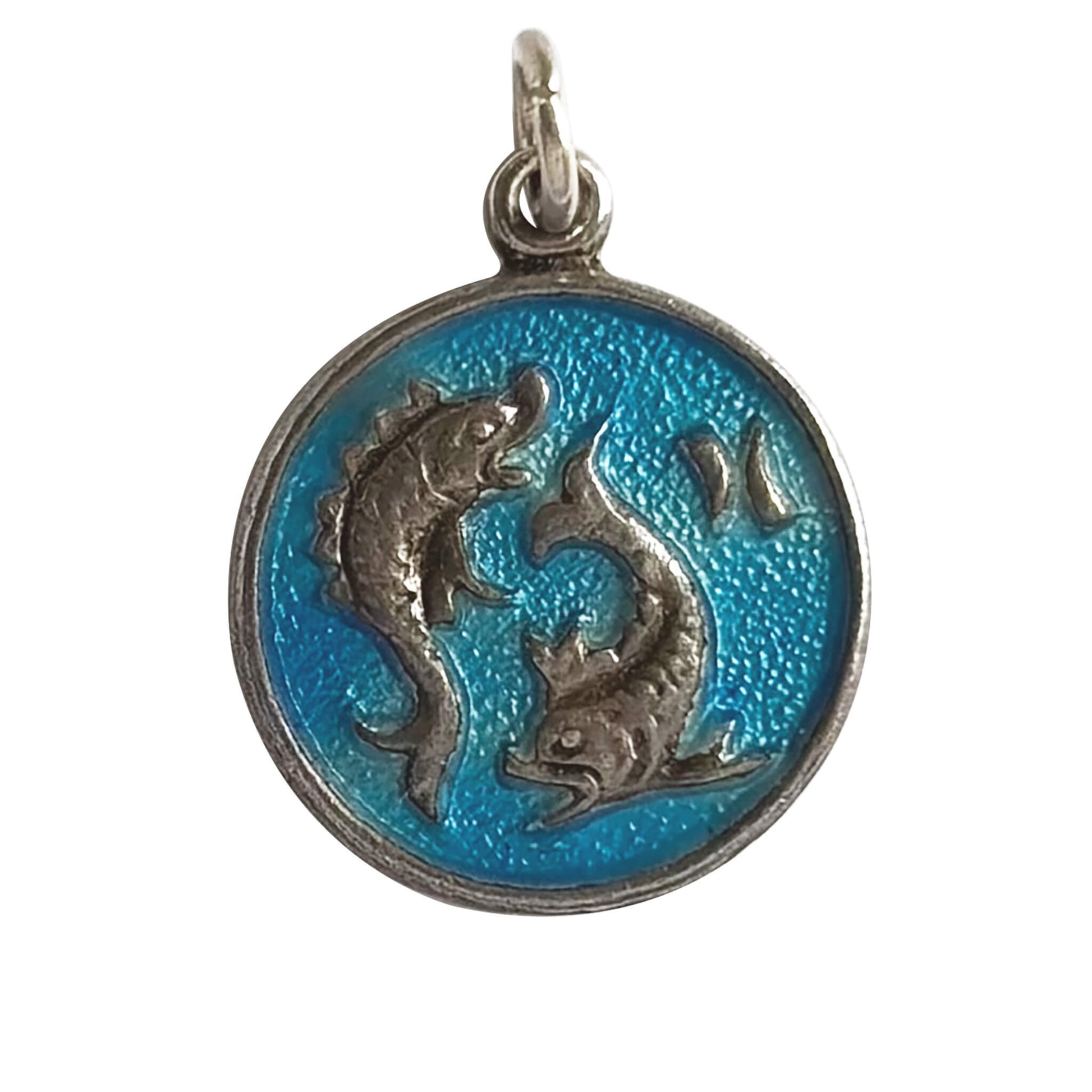 Pendant with two fish designs for Pisces on a blue background