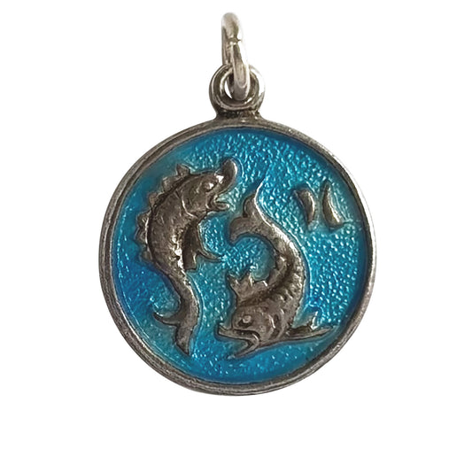 Pendant with two fish designs for Pisces on a blue background