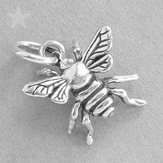 silver honey bee charm on grey background