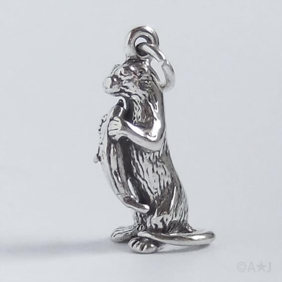 otter with fish charm