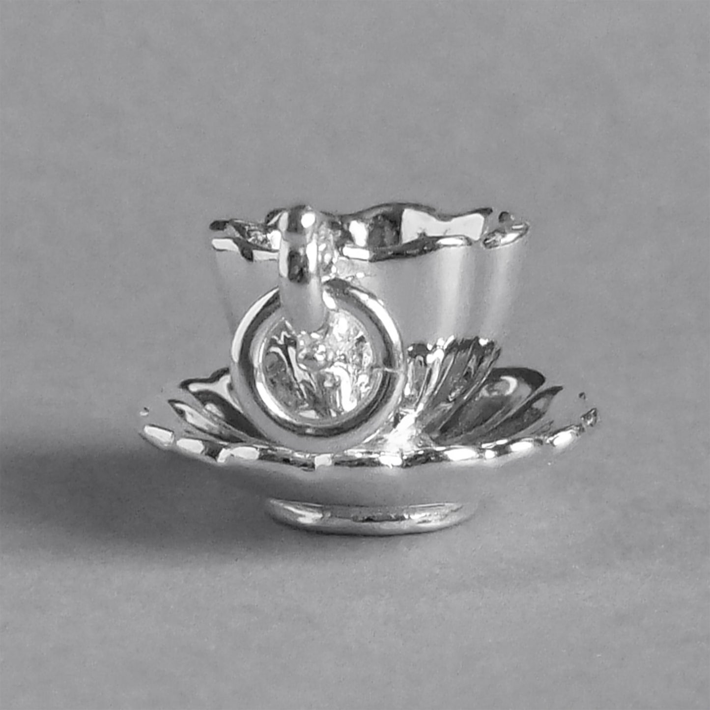 teacup and saucer charm