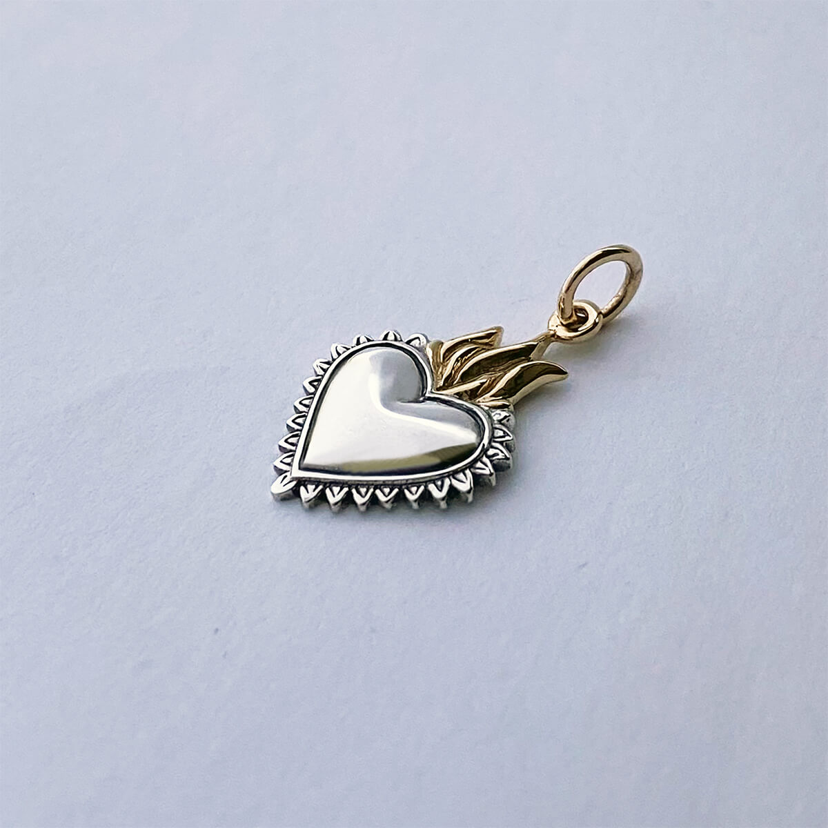 Flaming heart charm sterling silver and bronze religious pendant
