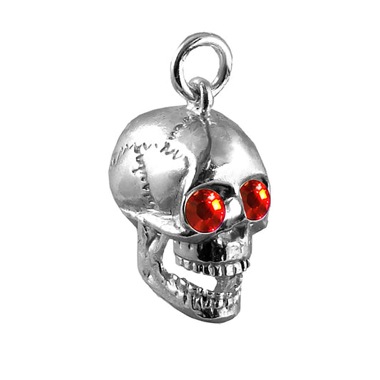 skull charm with red crystal eyes